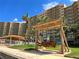 Wooden swing under a pergola at 880 Mandalay Ave # N111, Clearwater Beach, FL 33767