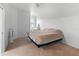 Main bedroom with a queen bed and carpeted floor at 9206 Bella Terraza Way, Temple Terrace, FL 33617