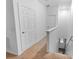 Upstairs hallway with carpet and two doors at 9206 Bella Terraza Way, Temple Terrace, FL 33617