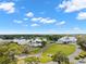 Aerial view of community clubhouse, pool, and golf course at 9287 New Orleans Dr, Weeki Wachee, FL 34613