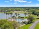 Community pool and tennis courts with lake view at 9287 New Orleans Dr, Weeki Wachee, FL 34613