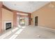 Living room with high ceilings, fireplace and neutral color palette at 9287 New Orleans Dr, Weeki Wachee, FL 34613