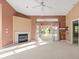 Bright living room with fireplace and access to backyard patio at 9287 New Orleans Dr, Weeki Wachee, FL 34613