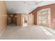 Open living room featuring vaulted ceilings, neutral carpeting and walls at 9287 New Orleans Dr, Weeki Wachee, FL 34613