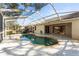 Inviting kidney-shaped pool with screened enclosure at 9287 New Orleans Dr, Weeki Wachee, FL 34613