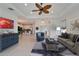 Bright living room with neutral décor, and a seamless connection to the adjacent rooms at 970 Pembroke Point Way, Sun City Center, FL 33573