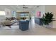 Bright living room with neutral décor, and a seamless connection to the outdoor patio at 970 Pembroke Point Way, Sun City Center, FL 33573