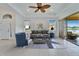 Bright living room with neutral decor and a seamless connection to the outdoor view at 970 Pembroke Point Way, Sun City Center, FL 33573