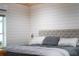 Serene bedroom showcases a plush upholstered headboard, soft lighting, and a calming, neutral color palette for relaxation at 10350 54Th N Ave, St Petersburg, FL 33708