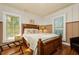 Inviting bedroom with wood floors, natural light, and comfortable furnishings at 10350 54Th N Ave, St Petersburg, FL 33708