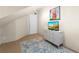 View of a bedroom with neutral walls and a colorful rug on the floor at 10350 54Th N Ave, St Petersburg, FL 33708