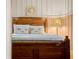 Charming bedroom featuring light colors, wooden floors, and a decorative painting on the wall at 10350 54Th N Ave, St Petersburg, FL 33708