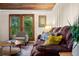 Comfortable living room with hardwood floors, view of the outdoors, wood trim, and plush seating at 10350 54Th N Ave, St Petersburg, FL 33708