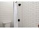 Modern shower area with subway tile, white shower curtain, and updated hardware at 10350 54Th N Ave, St Petersburg, FL 33708