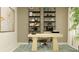 Modern home office with light wood desk and built-in shelving at 10625 Gable Dig Loop, San Antonio, FL 33576