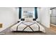 Comfortable bedroom with a large bed and teal curtains at 1212 Markley Dr, Largo, FL 33770