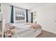 Cozy bedroom featuring a full-size bed and window coverings at 1212 Markley Dr, Largo, FL 33770