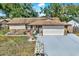 House exterior with stone accents and American flag at 1212 Markley Dr, Largo, FL 33770