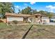 House exterior with stone accents and American flag at 1212 Markley Dr, Largo, FL 33770