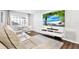 Living room featuring a large screen TV and comfortable seating at 1212 Markley Dr, Largo, FL 33770