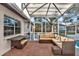 Relaxing screened-in pool area with patio furniture at 1212 Markley Dr, Largo, FL 33770