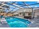 Sparkling pool with a large screened-in patio area at 1212 Markley Dr, Largo, FL 33770