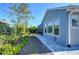 Landscaped backyard with pavers and lush greenery at 13903 Natures Reserve Dr, Lithia, FL 33547
