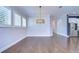 Bright dining room with hardwood floors and elegant light fixture at 13903 Natures Reserve Dr, Lithia, FL 33547