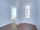 Bright entryway with hardwood floors and a glass front door at 13903 Natures Reserve Dr, Lithia, FL 33547