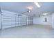 Two-car garage with epoxy flooring and automatic openers at 13903 Natures Reserve Dr, Lithia, FL 33547