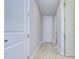 Bright hallway with tile flooring and neutral walls at 13903 Natures Reserve Dr, Lithia, FL 33547