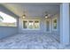 Spacious lanai with multiple windows and a door at 13903 Natures Reserve Dr, Lithia, FL 33547