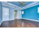 Spacious main bedroom with hardwood floors and access to bathroom at 13903 Natures Reserve Dr, Lithia, FL 33547