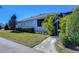 Side yard with walkway leading to a screened patio area at 13903 Natures Reserve Dr, Lithia, FL 33547