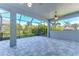 Spacious screened-in patio with tile flooring and ceiling fans at 13903 Natures Reserve Dr, Lithia, FL 33547