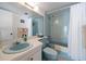 Light blue bathroom with tub, shower, and updated vanity at 15462 Gulf Blvd # 603, Madeira Beach, FL 33708