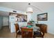 Dining area with kitchen view and glass-top table at 15462 Gulf Blvd # 603, Madeira Beach, FL 33708