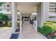 Building entrance with stairs and landscaping at 15462 Gulf Blvd # 603, Madeira Beach, FL 33708