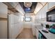 White kitchen with appliances, washer, dryer, and ocean view at 15462 Gulf Blvd # 603, Madeira Beach, FL 33708