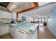 Kitchen with breakfast bar and view into living room and ocean at 15462 Gulf Blvd # 603, Madeira Beach, FL 33708