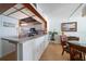 Kitchen with breakfast bar, looking toward dining area and ocean view at 15462 Gulf Blvd # 603, Madeira Beach, FL 33708