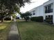 Community grounds with lush landscaping and walkways at 2060 Marilyn St # 133, Clearwater, FL 33765