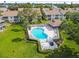 Community pool with surrounding lounge chairs and a gazebo at 223 Sun Vista S Ct, Treasure Island, FL 33706