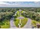 Aerial view of community with lush landscaping and fountain at 2311 Brisbane St # 65, Clearwater, FL 33763