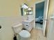 Bathroom with toilet, sink, and access to bedroom at 2311 Brisbane St # 65, Clearwater, FL 33763