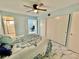 Bedroom with a bed, large closet and marble floors at 2311 Brisbane St # 65, Clearwater, FL 33763