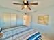 Bedroom with double bed, ceiling fan, and window at 2311 Brisbane St # 65, Clearwater, FL 33763