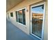 Condo entry with glass door and balcony view at 2311 Brisbane St # 65, Clearwater, FL 33763