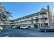 Two-story building with parking and landscaping at 2311 Brisbane St # 65, Clearwater, FL 33763