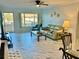 Living room with tile floors and patio access at 2311 Brisbane St # 65, Clearwater, FL 33763